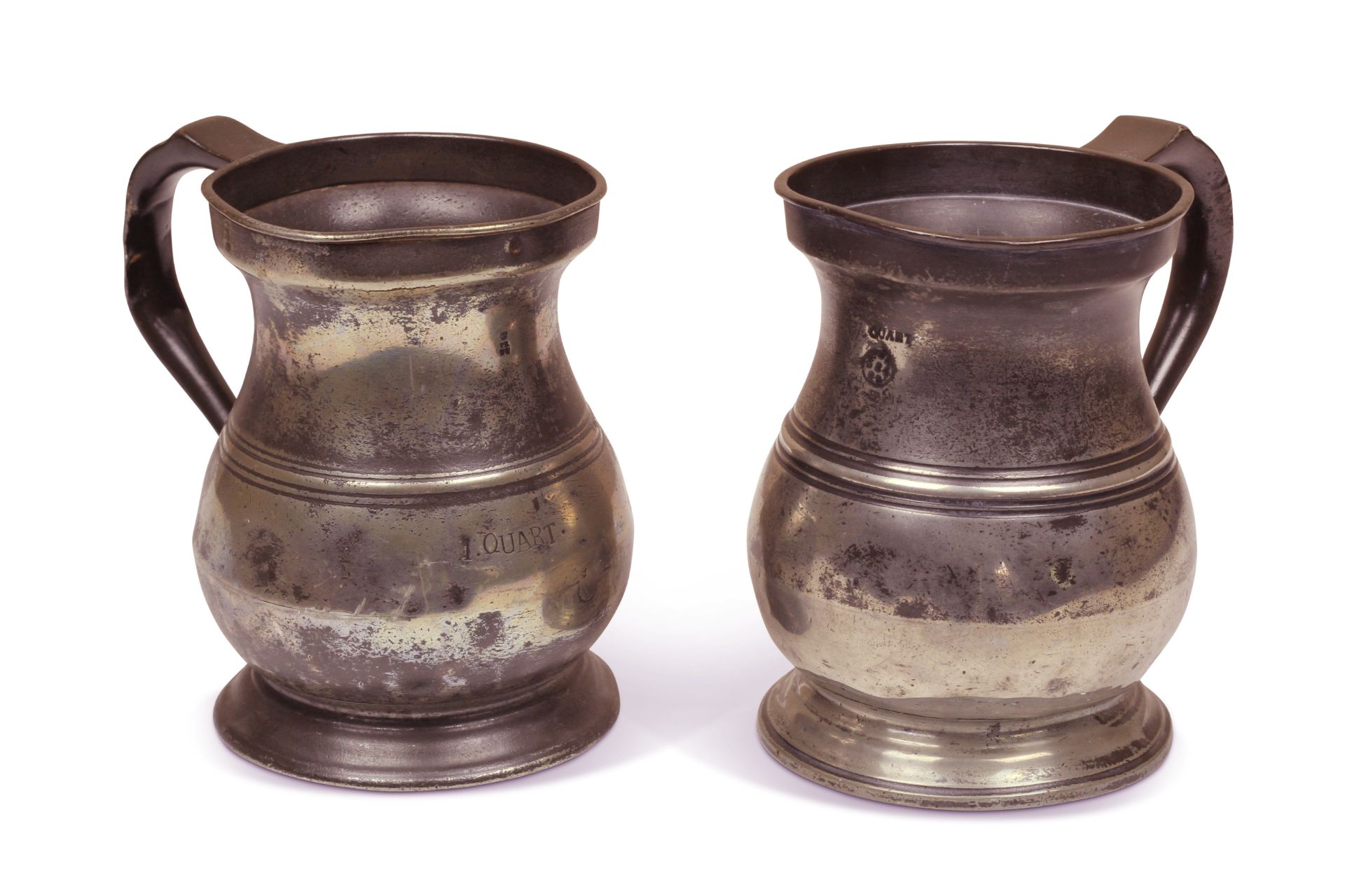 Two 18th century pewter quart handled tankards