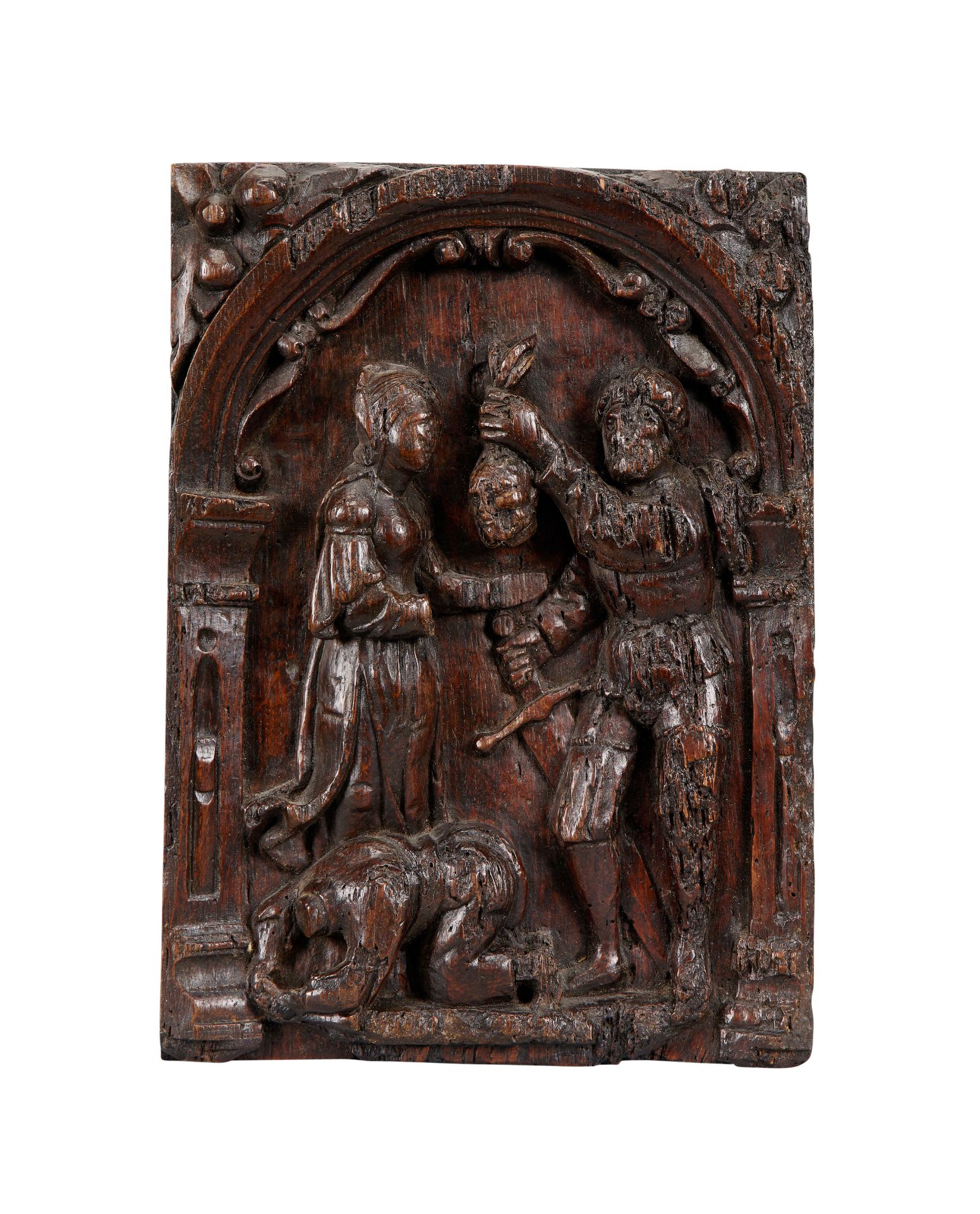 An early 17th century carved oak panel depicting the beheading of John the Baptist