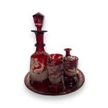 A suite of 19th century Bohemian ruby etched glass