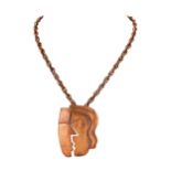 A vintage Rebajes, ‘The Kiss’ copper pendant necklace