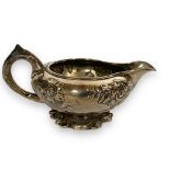 A George IV silver milk jug, London 1818, retailed by Makepeace, London