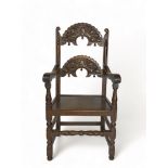 A 17th century style carved oak Derbyshire open armchair