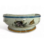An 18th century French Bourgogne faience cistern together with a late 19th century Gien blue and whi