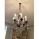 A 19th century and later black painted glass drop hung six light chandelier