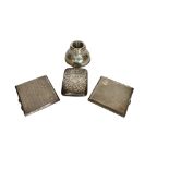 Three Edwardian silver cigarette cases and a hammered silver pen pot