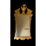 A George I style carved giltwood and gesso mirror