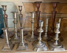 Six pairs of 18th / 19th century brass candlesticks