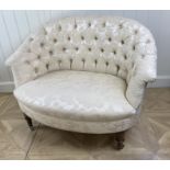 A Victorian walnut and upholstered love seat