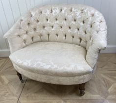 A Victorian walnut and upholstered love seat