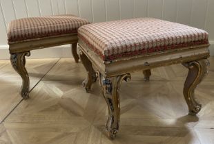 A pair of late 19th century later cream painted and parcel gilt foot stools In the Louis XV style,