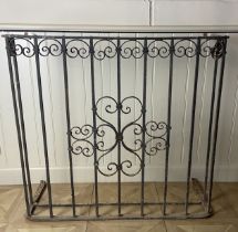 A 19th century French 'D' shaped wrought iron scrolling balcony 100cm wide, 38cm deep, 90cm high.