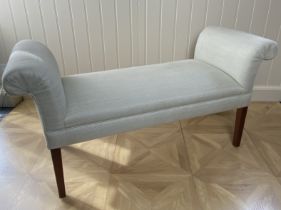 A modern beige upholstered window seat by Kingcome The rectangular padded seat with scroll arms,