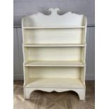 A Regency style cream painted waterfall bookcase