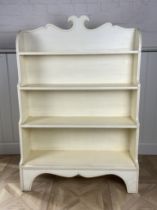 A Regency style cream painted waterfall bookcase