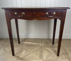 A George III mahogany side table The rectangular moulded top above a frieze drawers and shaped apron