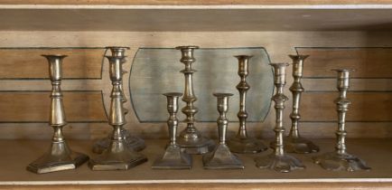 Five pairs of 18th / 19th century brass candlesticks