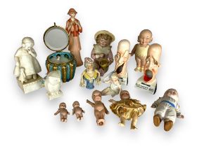 A group of early 20th century continental bisque porcelain dolls and figurines