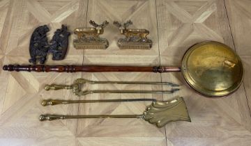 A set of 19th century brass fire tools, a pair of stag andirons, a pair of oak pierced carved
