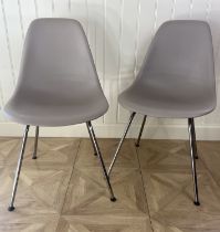 A pair of fawn moulded plastic DSX side chairs designed by Eames for Herman Miller Each 48cm wide,