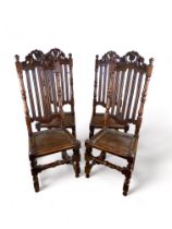 A set of four William and Mary carved oak high back side chairs