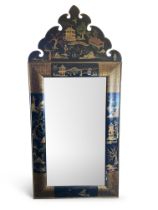 A large Queen Anne style arched black japanned mirror