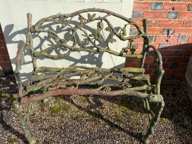 A small vintage rustic style cast iron bench