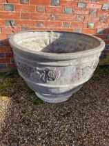 A large pair of large circular lead garden pots in the Arts and Crafts style