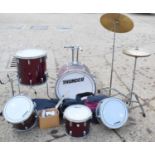 A "Thunder" drum kit together with a set of Peter Alliss golf clubs and various golf balls.