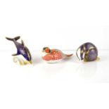 Three Royal Crown Derby paperweights comprising of a dolphin, badger and pheasant, all with gold