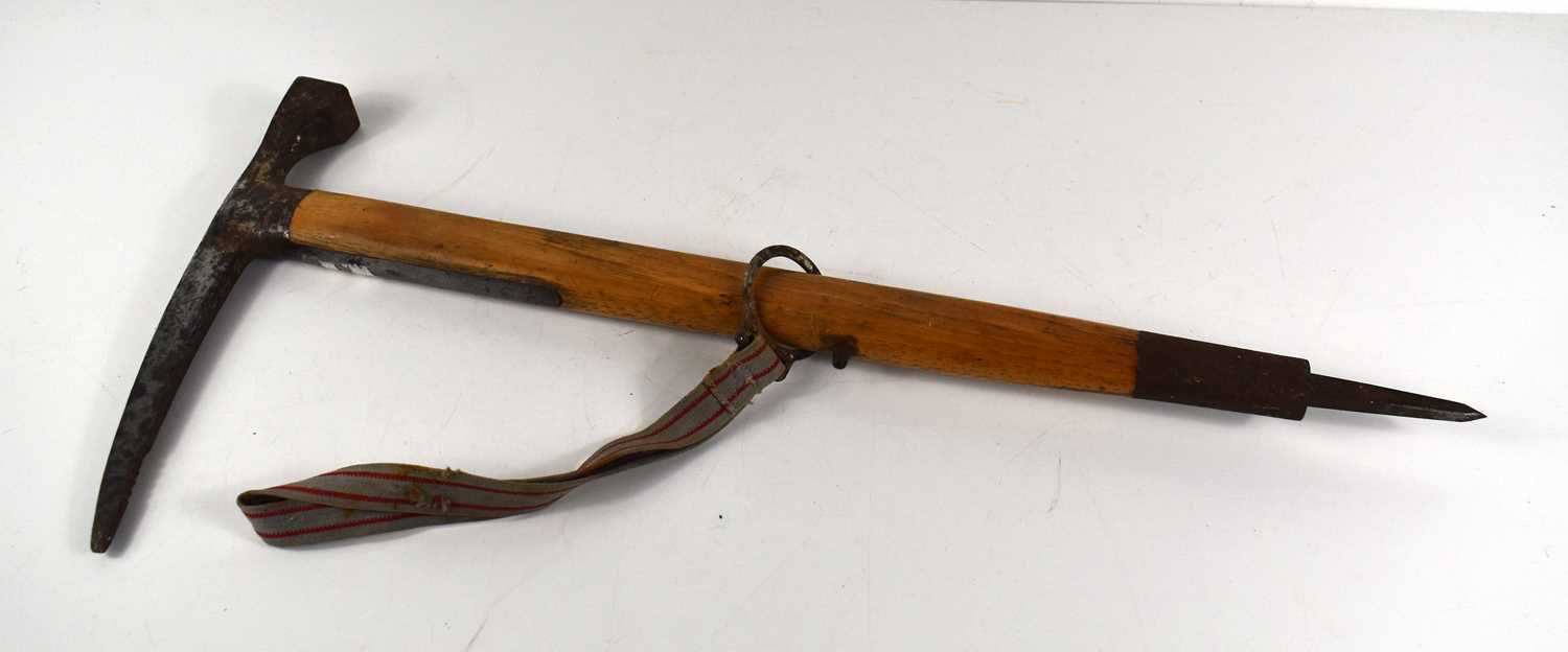 A vintage Austrian "Stubai" mountaineering ice axe / pick with ash handle and canvas strap.