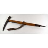 A vintage Austrian "Stubai" mountaineering ice axe / pick with ash handle and canvas strap.