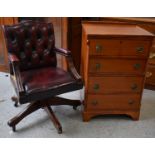 A small mahogany chest of four drawers together with a red leather button back swivel desk chair.