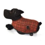 A vintage Schuco Tippy Terrier wind up dog.