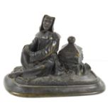 A bronze inkwell modelled in the form of demon/devil disguised as a beggar man on a oval bronze