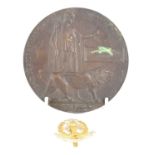 A WWI widow's penny plaque for Frederick Arthur Hawkins and a Middlesex Regiment cap badge.