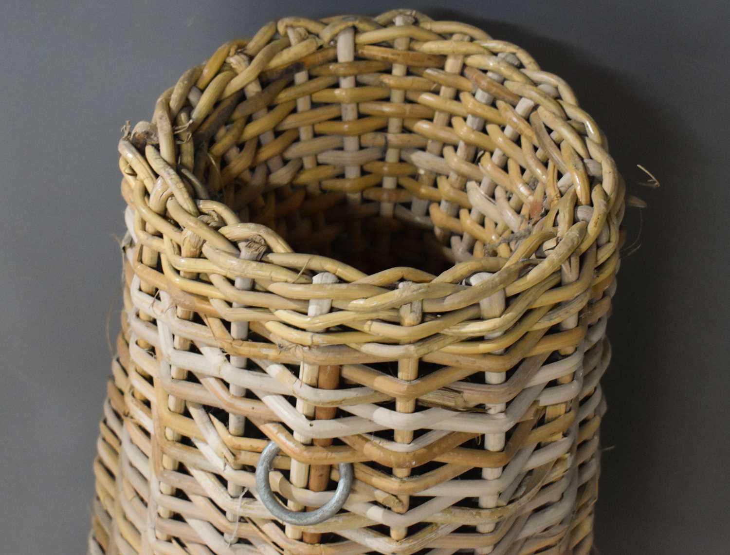 A vintage wicker eel basket, 72cm high.