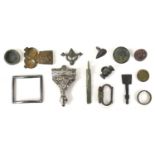 A group of metal detecting finds to include a Celtic toggle, Posy ring dated 1929, strap end,