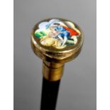 A 20th century continental walking cane with a white metal and enamel pill box to the handles,