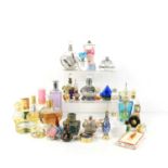 A group of glass scent bottles and some part-used perfumes to include Vera Wang and Yardley.