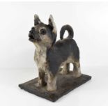 A clay stoneware sculpture of a standing dog on a rectangular base, apparently unsigned.