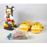 Four vintage novelty telephones, comprising of Mickey Mouse, Garfield and Mybelle Spotlight 753.