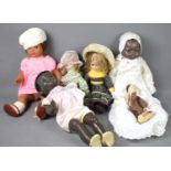 A group of vintage dolls to include examples with bisque heads and composite bodies.