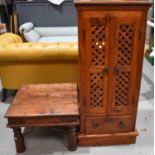 A Indonesian style hardwood coffee table together with a cabinet with lattice work panel doors and