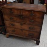 A 19th century mahogany chest of drawers with two short over three long graduated drawers raised