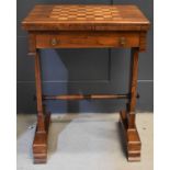 A 19th century Regency games table, with folding chess board inlaid top opening to reveal a circular