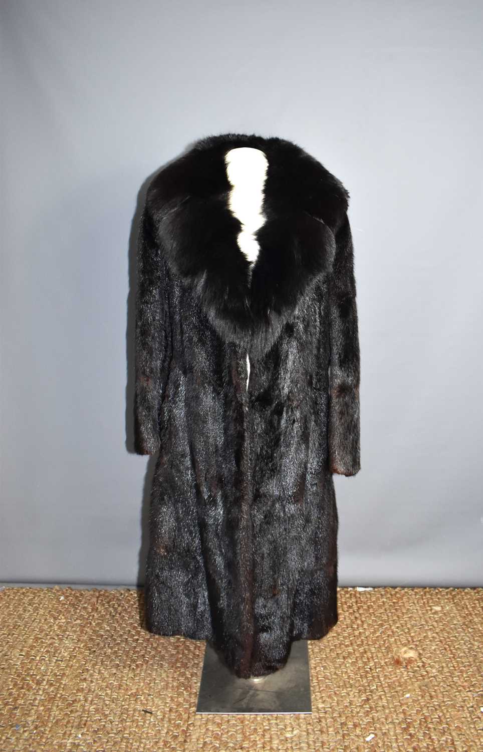 A 1970's black mink coat, together with a champagne coloured mink, a jacket, a fur collar and two