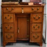 A 19th century satinwood and cross banded ladies kneehole desk / dressing table, fitted with long