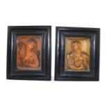 A pair of wax work relief panels depicting female martyrs, in ebonised frames, 13cm by 10cm.