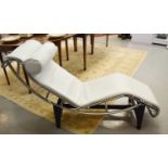 A Le Corbusier style white leather chaise longue, with polished chrome frame base / stand.