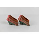 A pair of 19th century Chinese lotus shoes in silk, decorated with gold/silver coloured